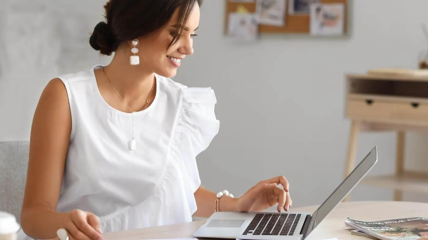 Woman looking at laptop