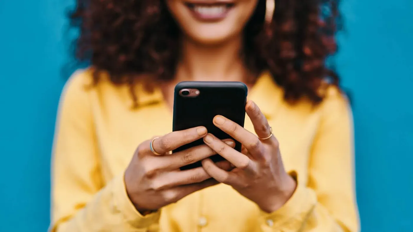 woman looking at her smartphone
