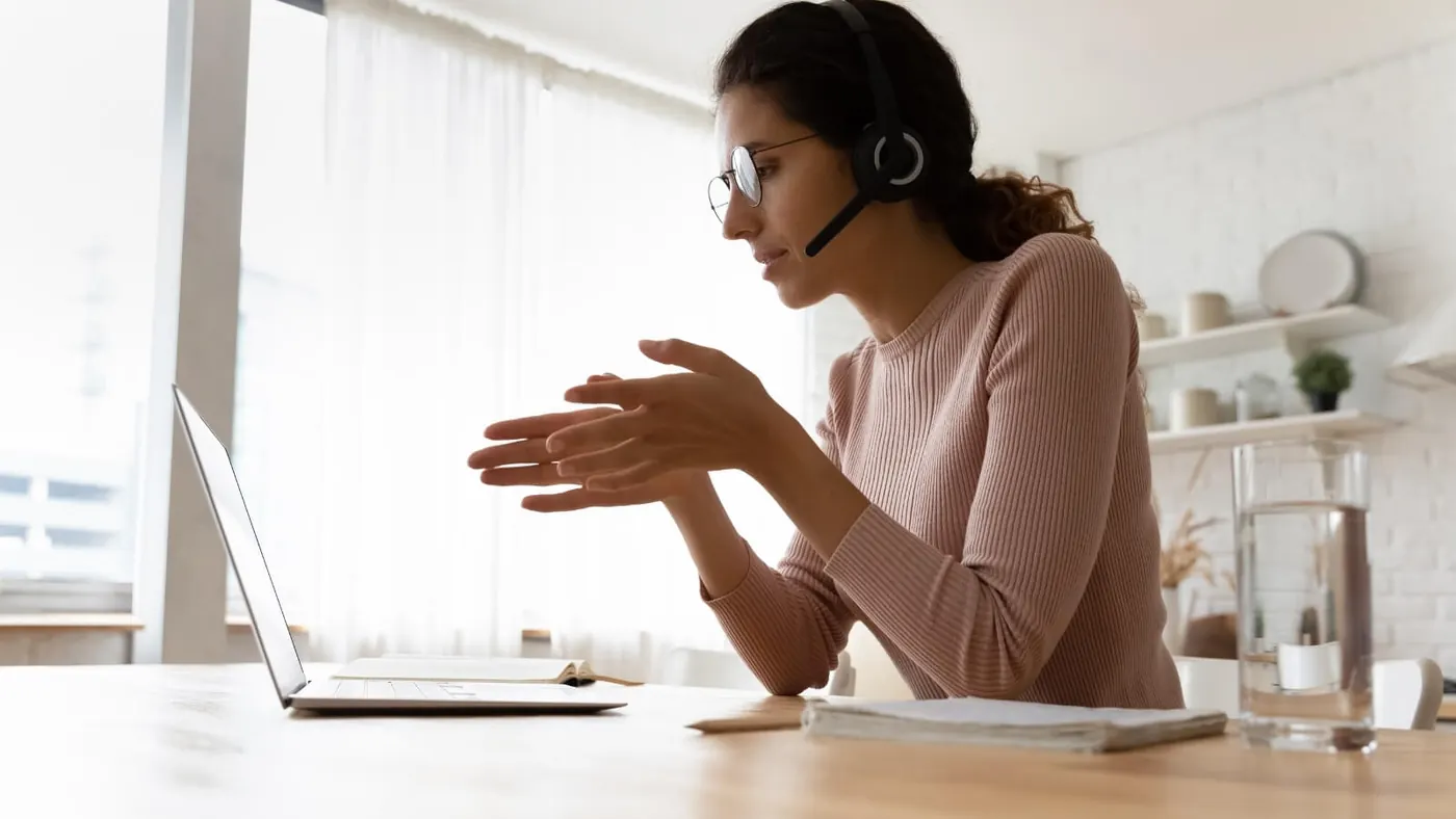Woman talking on webinar wearing headset