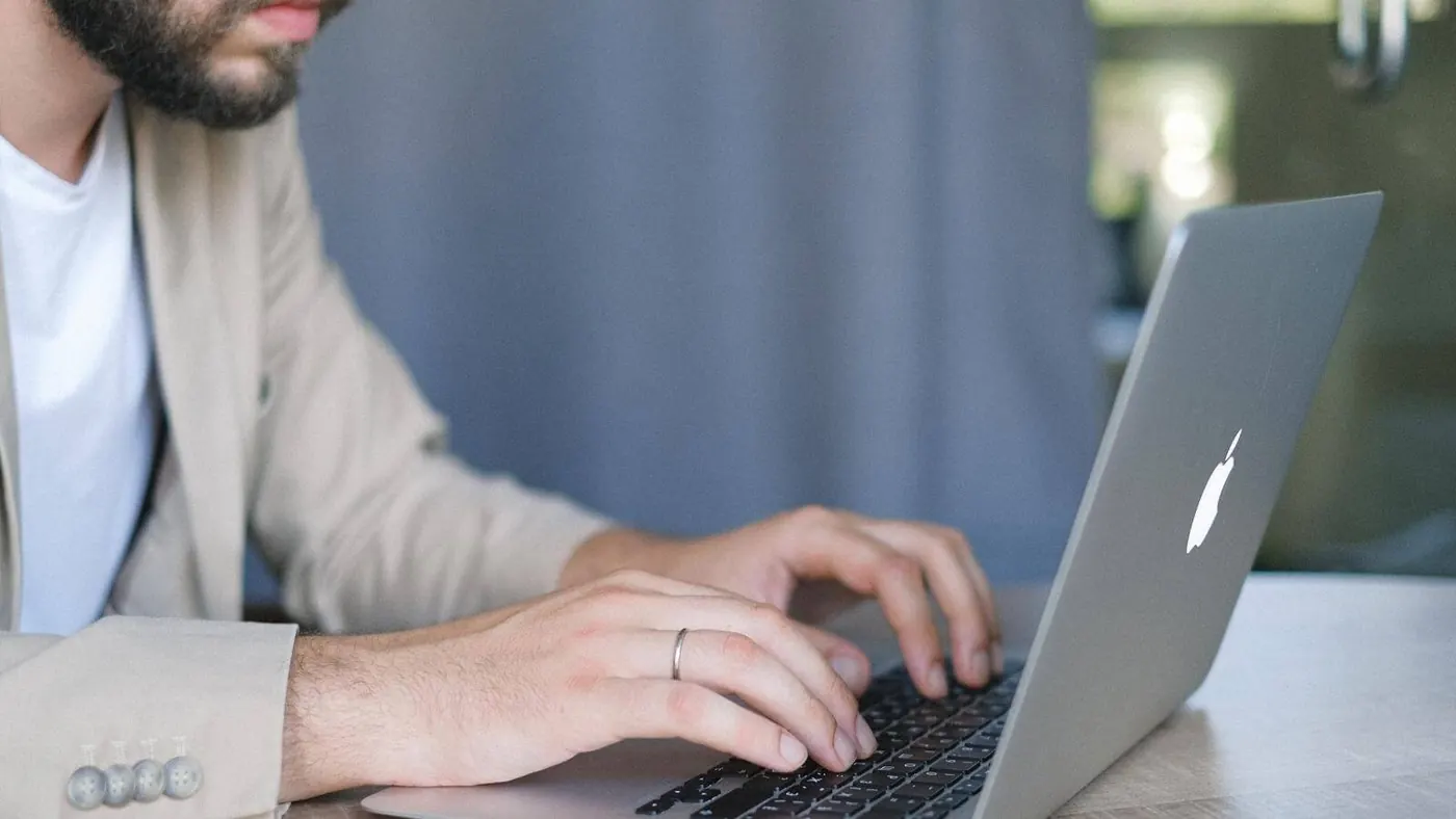 businessman-browsing-portable-laptop-indoors-5325051/ ‍